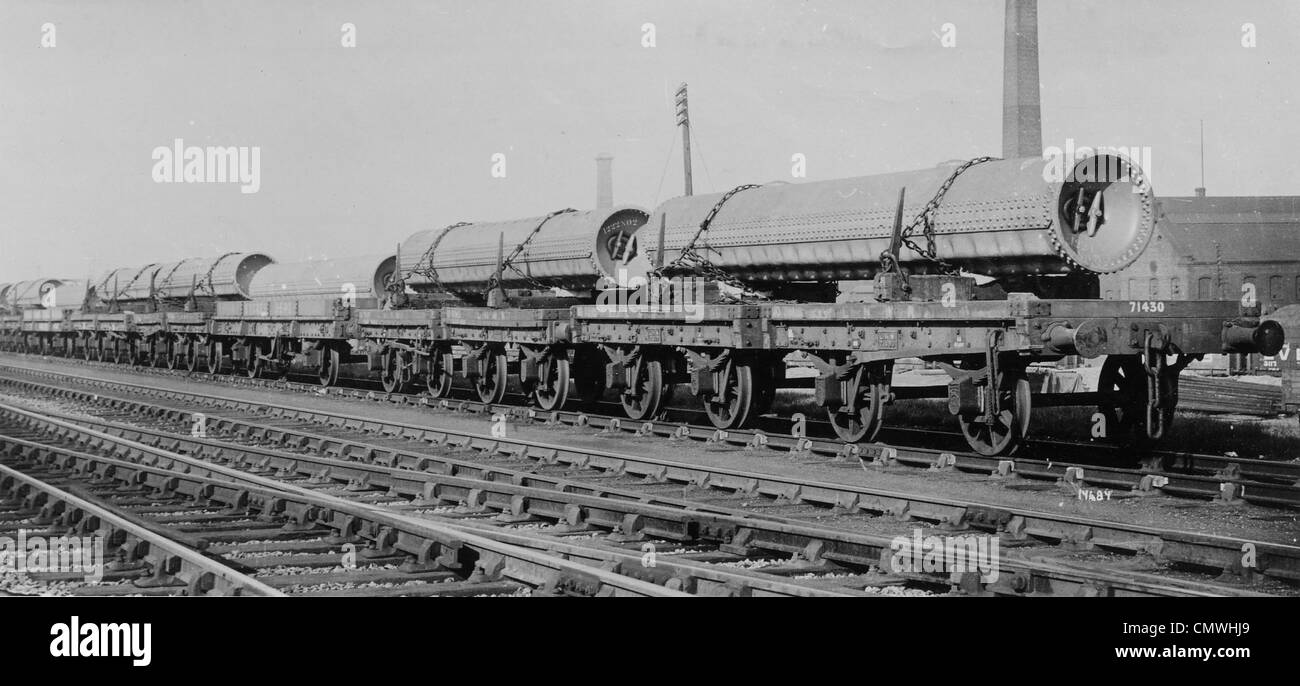 Boilers, John Thompson (Wolverhampton) Ltd. Wolverhampton, Mid 20th cent. A  line of boilers on rail freight carriers, outside Stock Photo - Alamy