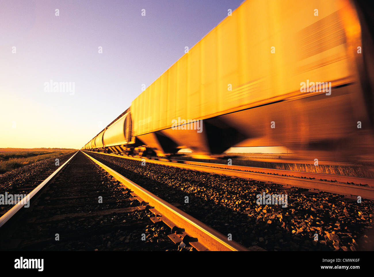 Speeding Rail Hopper Cars, near Winnipeg, Manitoba Stock Photo