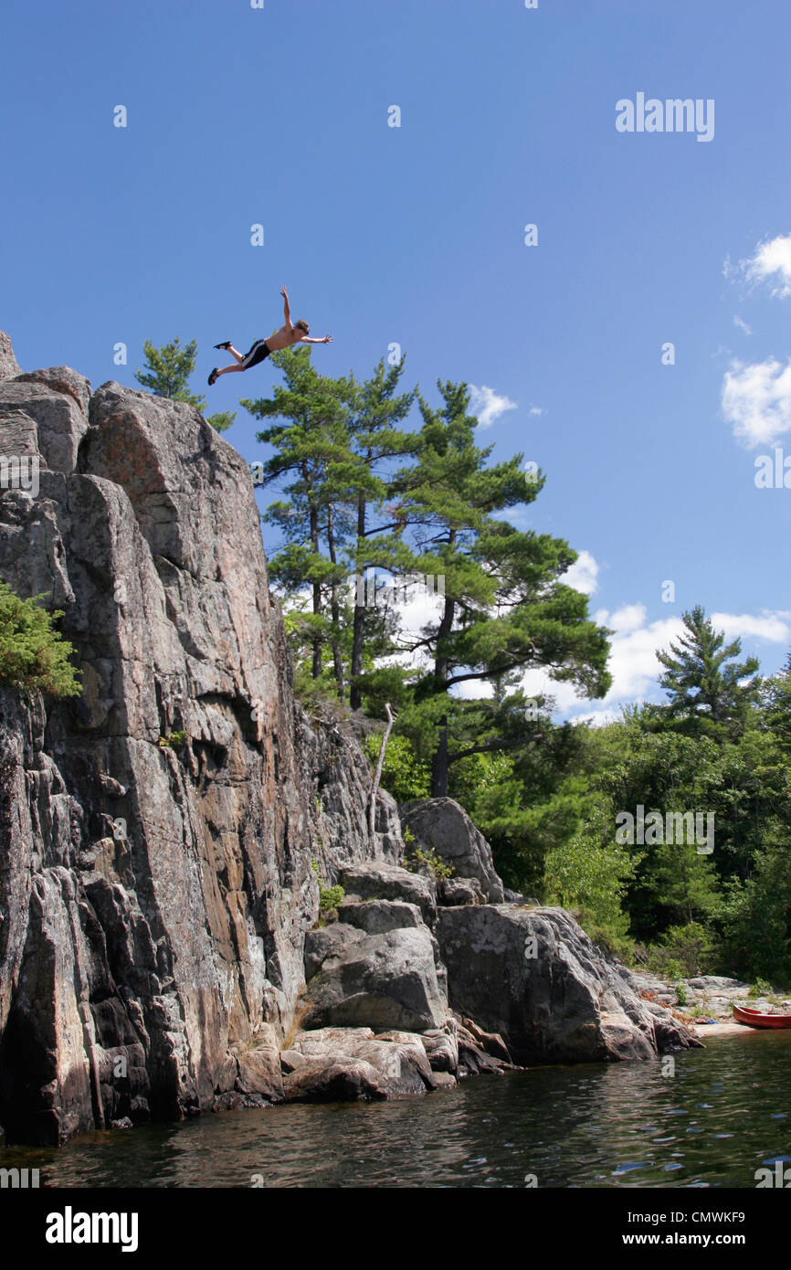 Man Diving off a Cliff, The Massasauga Provincial Park, Bay