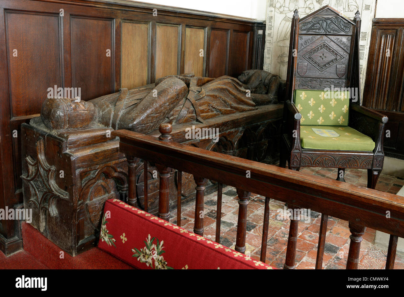 Interior and Exterior elements of St Michael and All Angels Church in Pitchford.Wooden effigy near the altar. Stock Photo