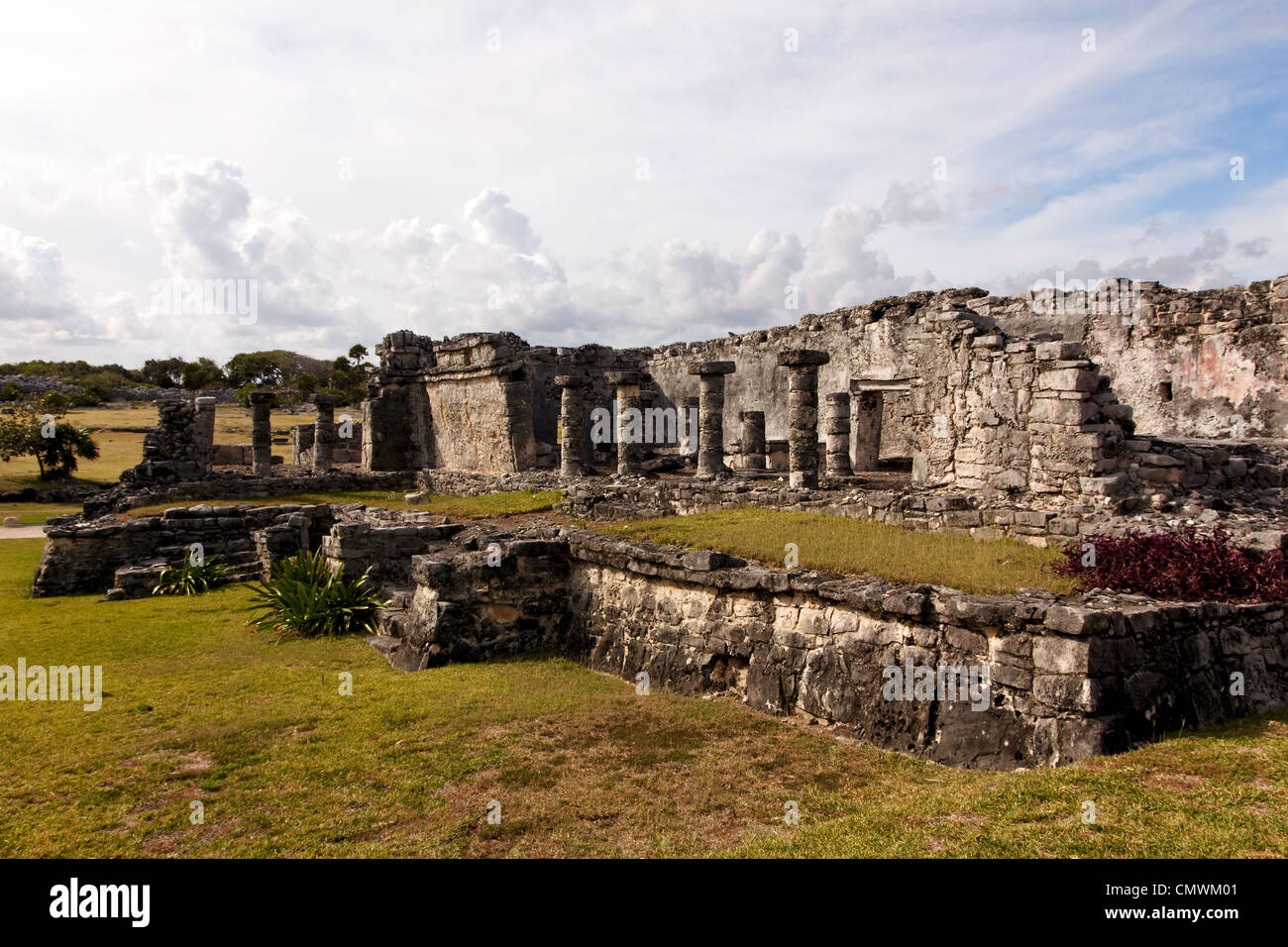 Crumbling remains of a large Mayan building at the archaeological zone of Tulum, Quintana Roo, Mexico. Stock Photo