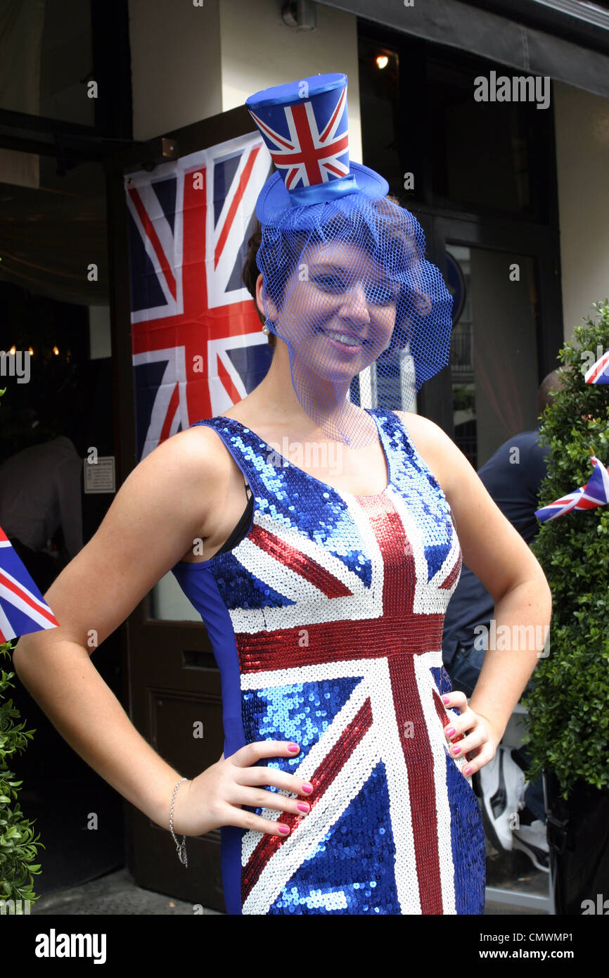 Young Female Wearing Union Jack Dress And Hat During The Royal