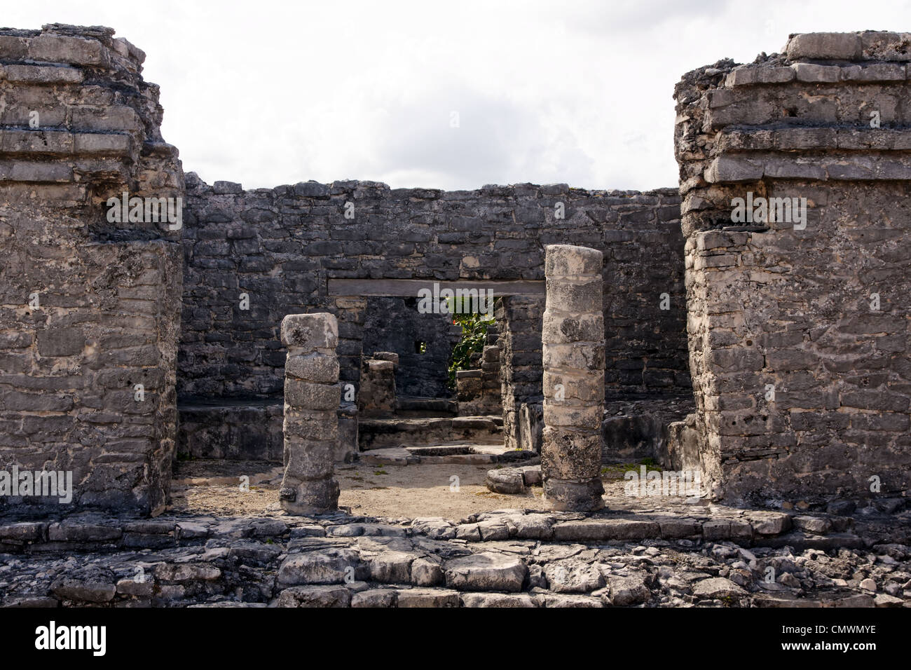 View into a Mayan ruin through the remains of it's access portal at Tulum, Quintana Roo, Mexico. Stock Photo