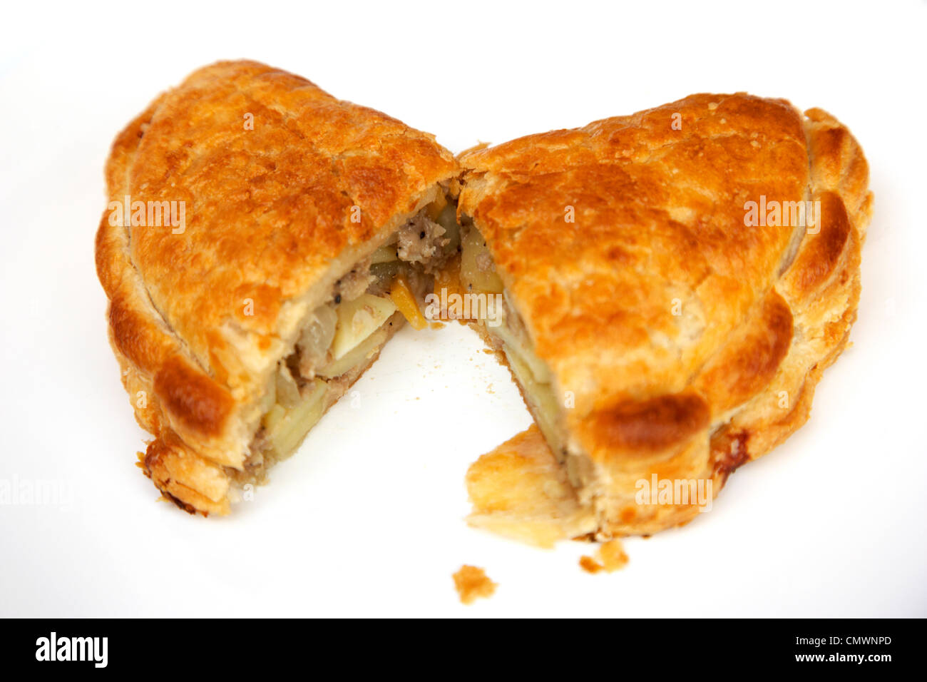 hot cornish pasty cut open and served on a plate Stock Photo