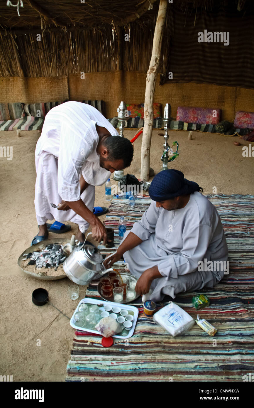 Bedouins of the Eastern Desert of Egypt, preparing the tea with their ancient ritual Stock Photo