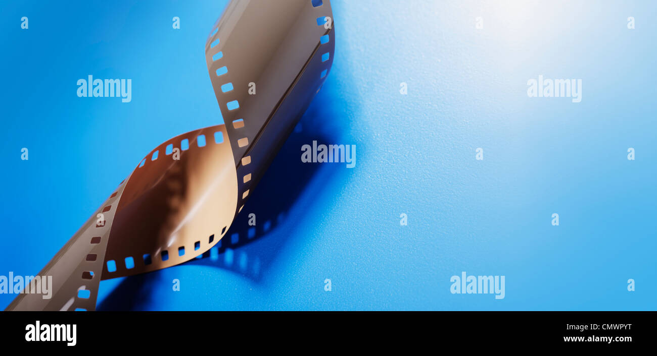 35mm Film on blue background with copy space. Stock Photo