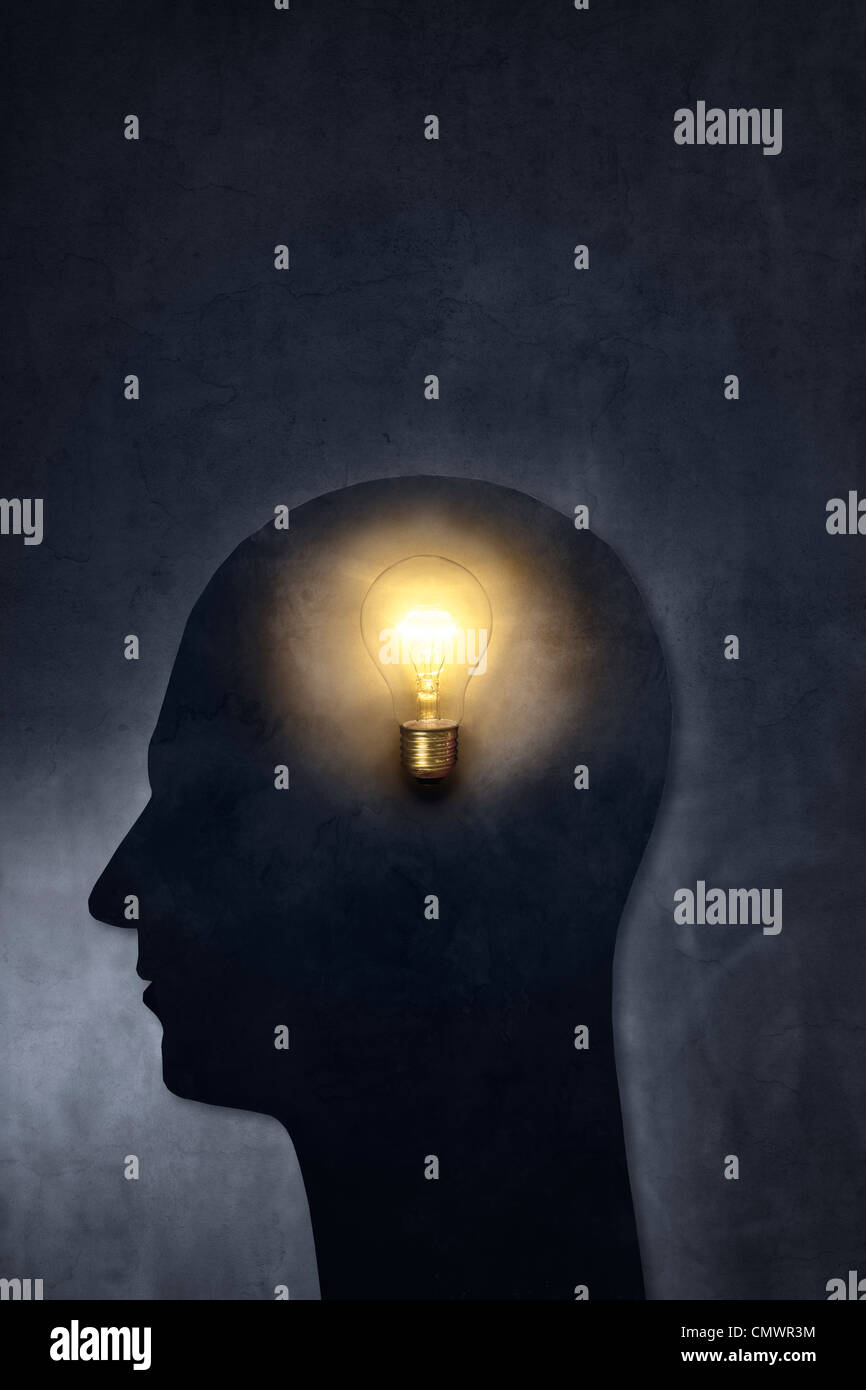 Artistic silhouette of a head with a bulb Stock Photo - Alamy