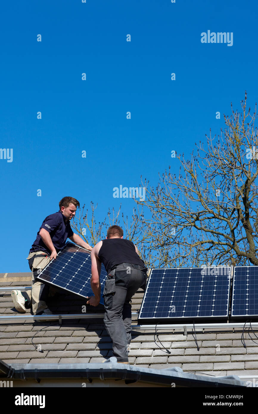 Solar panel installation on a roof Stock Photo
