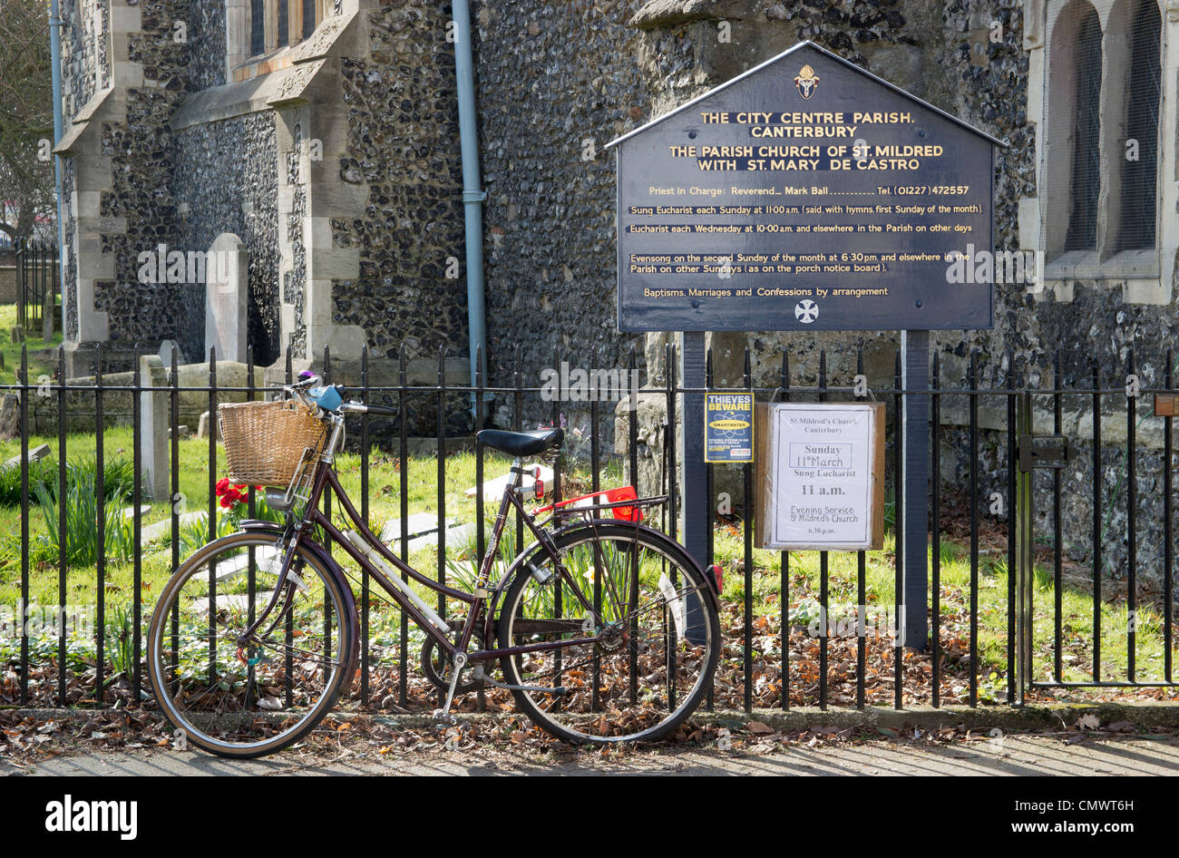 Church flower arranger Ladies bicycle with basket outside church. Stock Photo