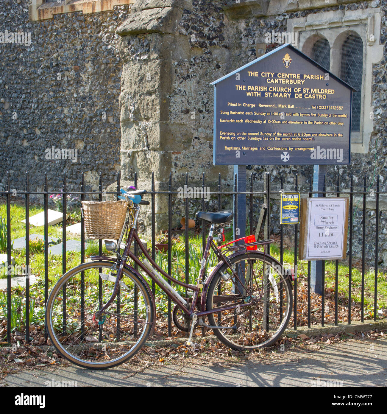 Church flower arranger Ladies bicycle with basket outside church. Stock Photo