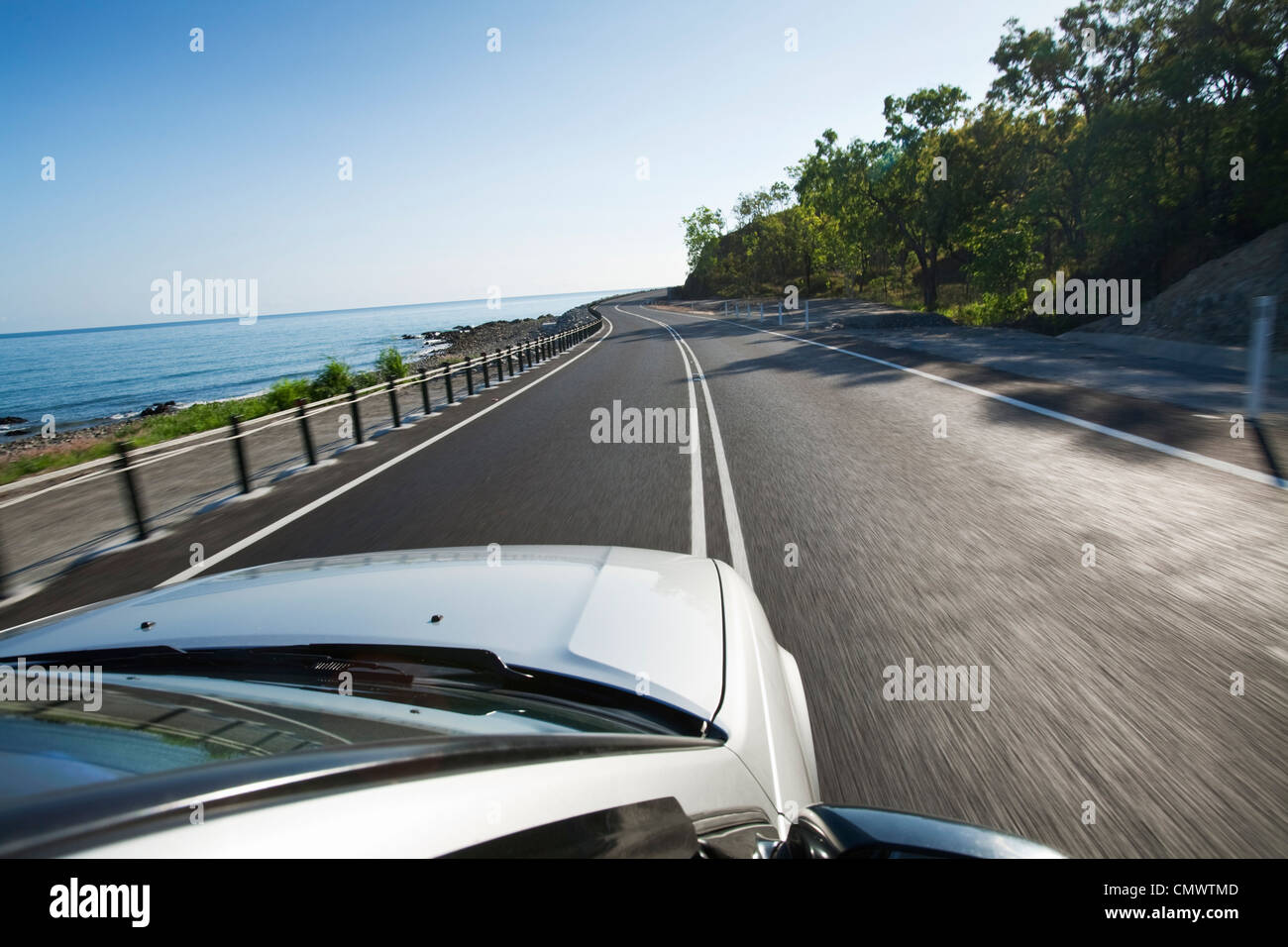 Driving along scenic coastline. Captain Cook Highway, Cairns, Queensland, Australia Stock Photo