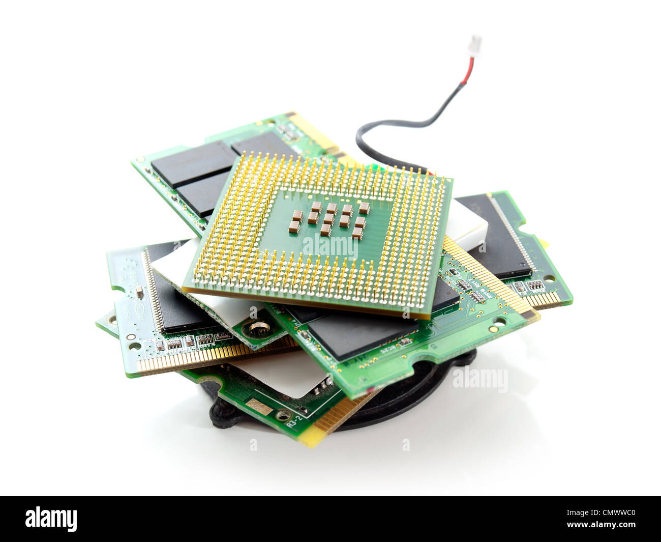 Various parts of computer hardware in a pile on white background Stock