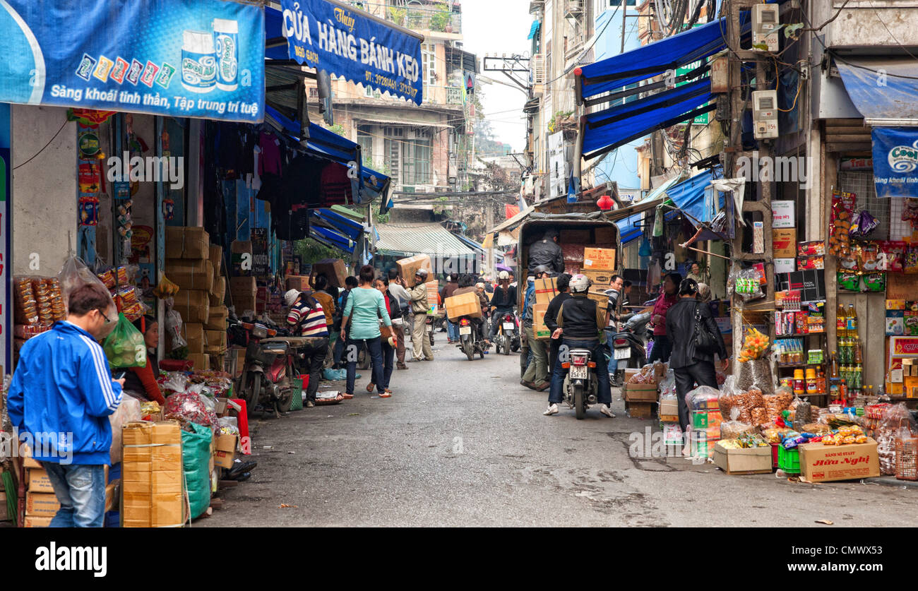 market sellers shops stores people street road city baskets  wares products vegetables fresh hanoi vietnam vietnamese Stock Photo
