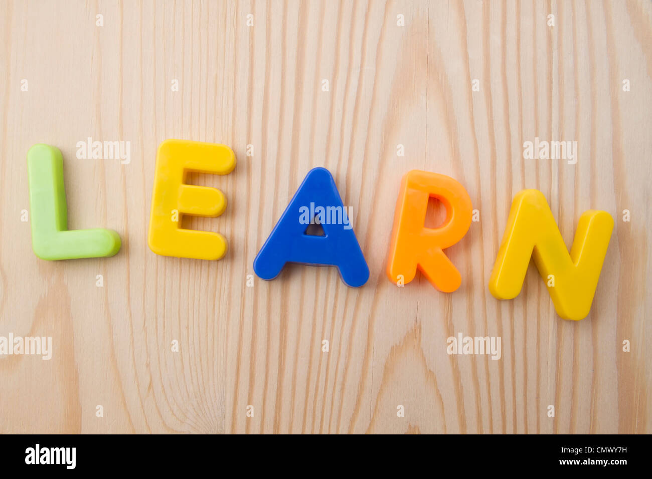 letter-magnets-learn-closeup-on-wood-background-stock-photo-alamy