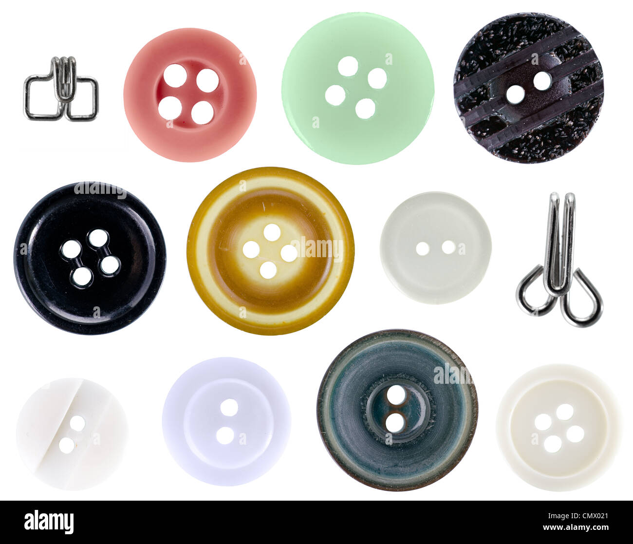 collection of vintage buttons and two hooks on a white background