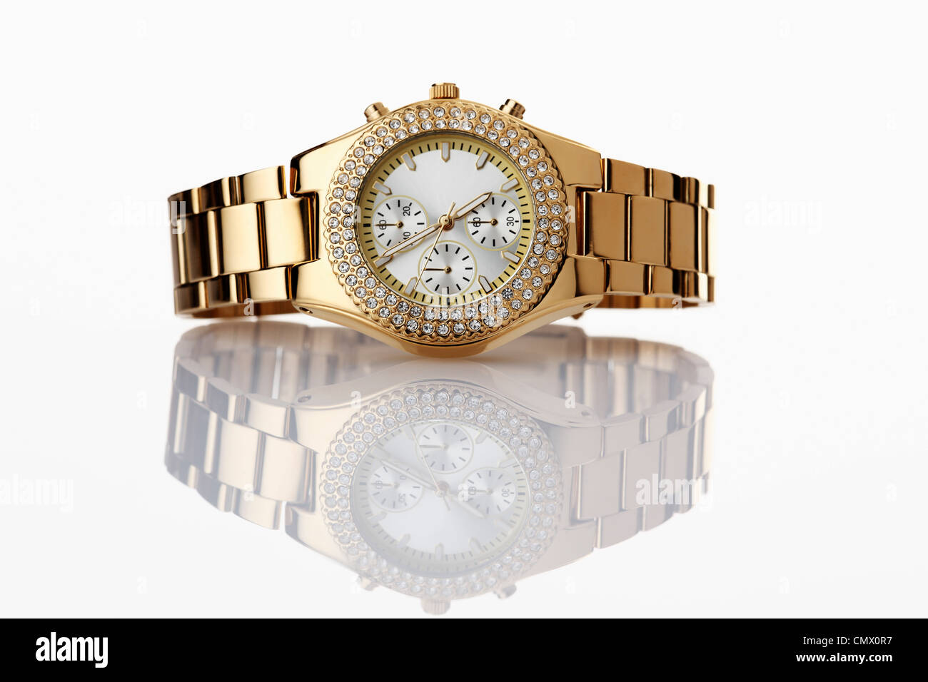 Golden wrist watch with jewels on white background Stock Photo - Alamy