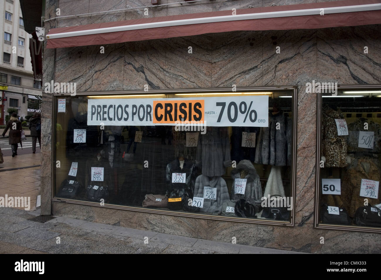 Spain Santander Fur shop sign Crisis discount cutting prices by 70 percent Stock Photo