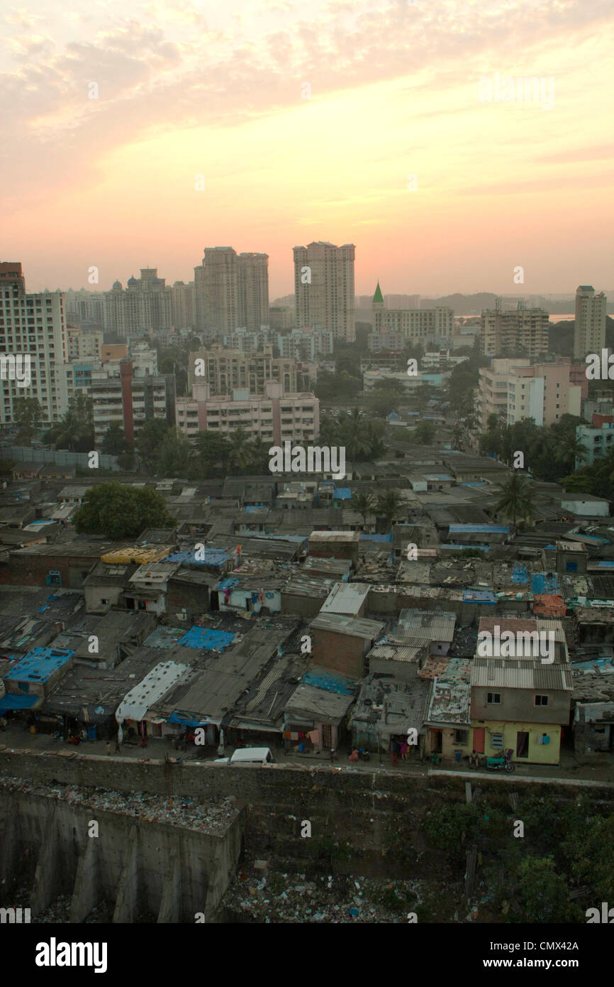 Mumbia slum with new City Towers in background at sunset Stock Photo