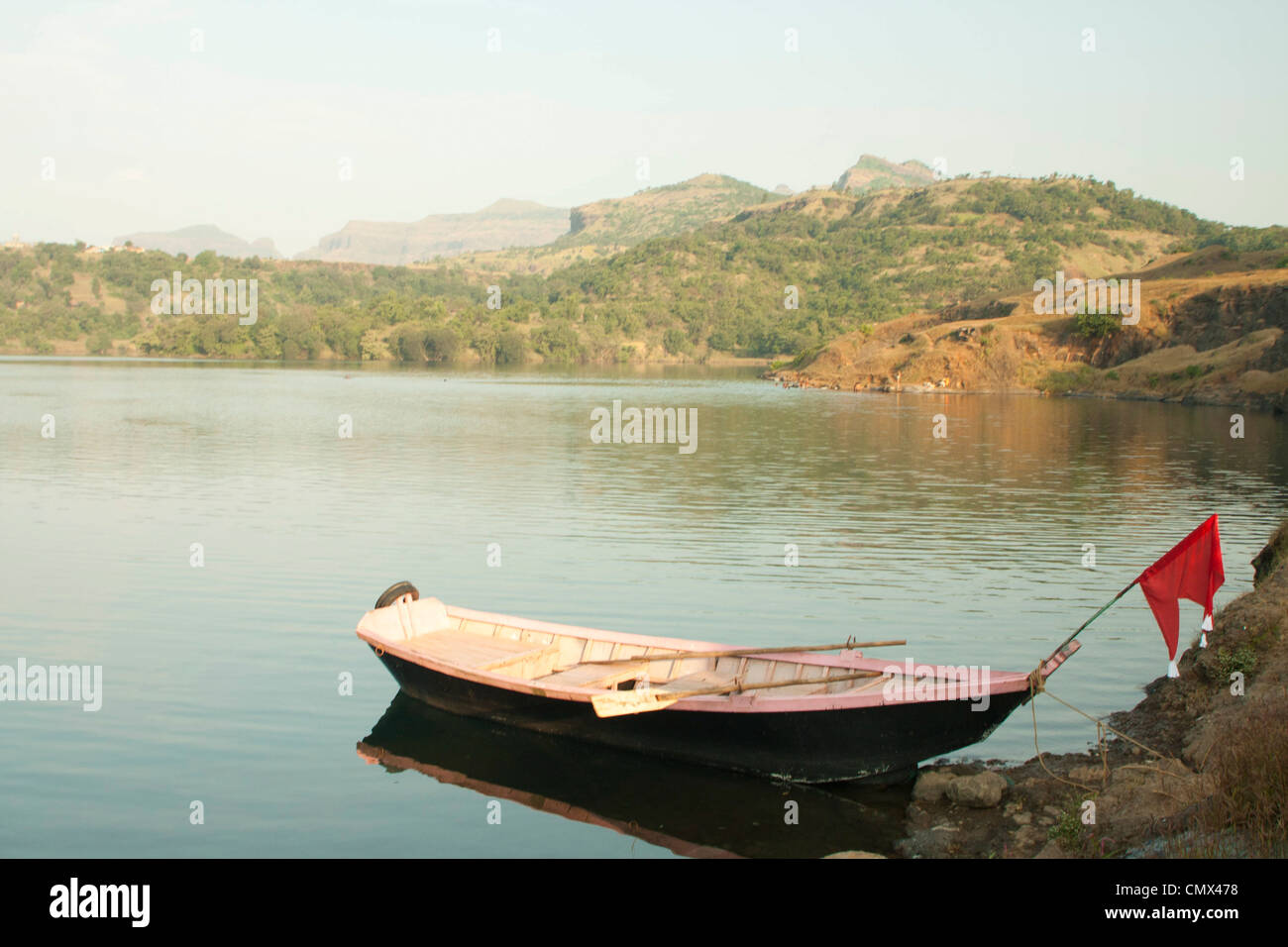 Rowing boat moored on indian lake Stock Photo - Alamy