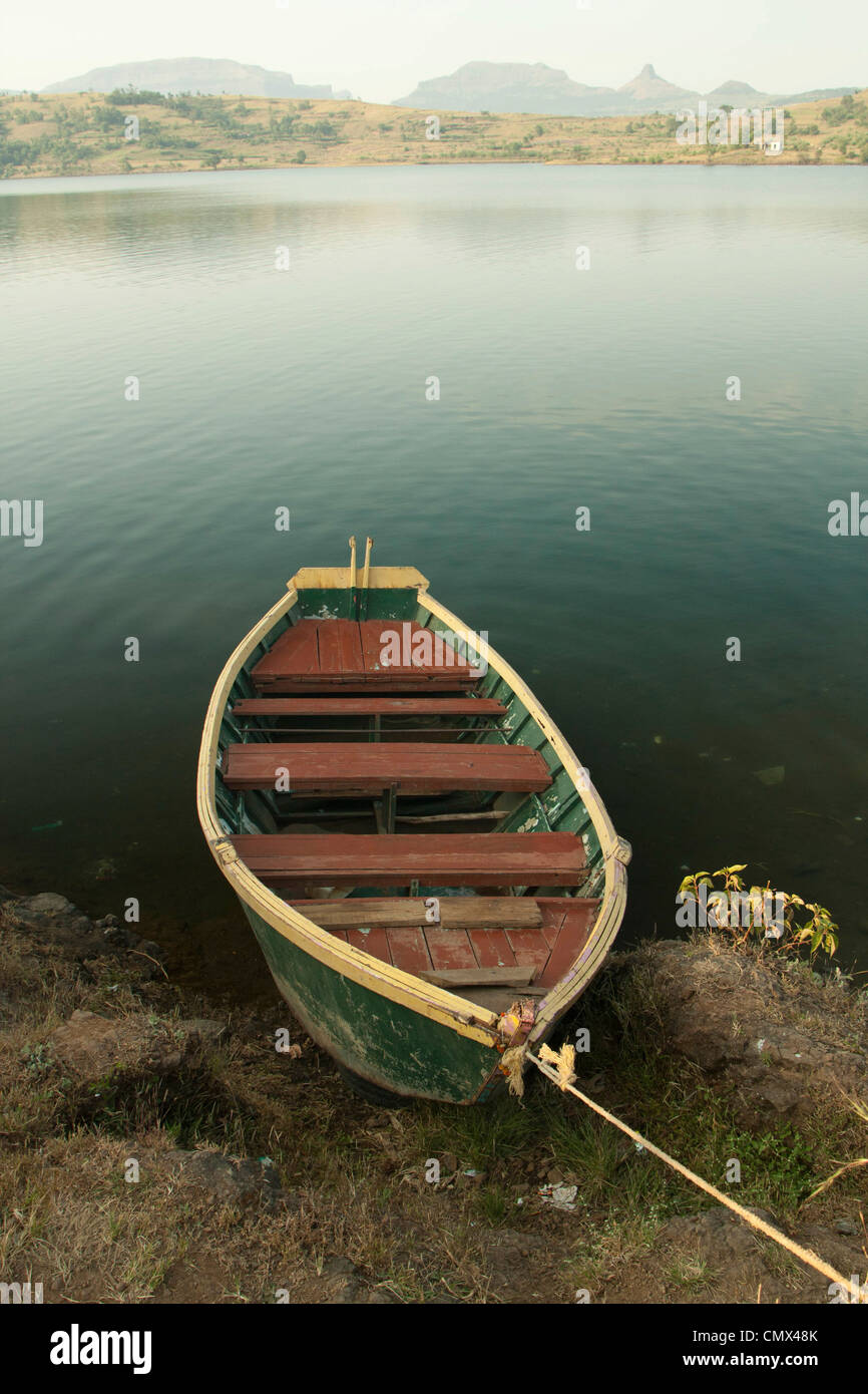 Rowing boat moored on indian lake Stock Photo - Alamy