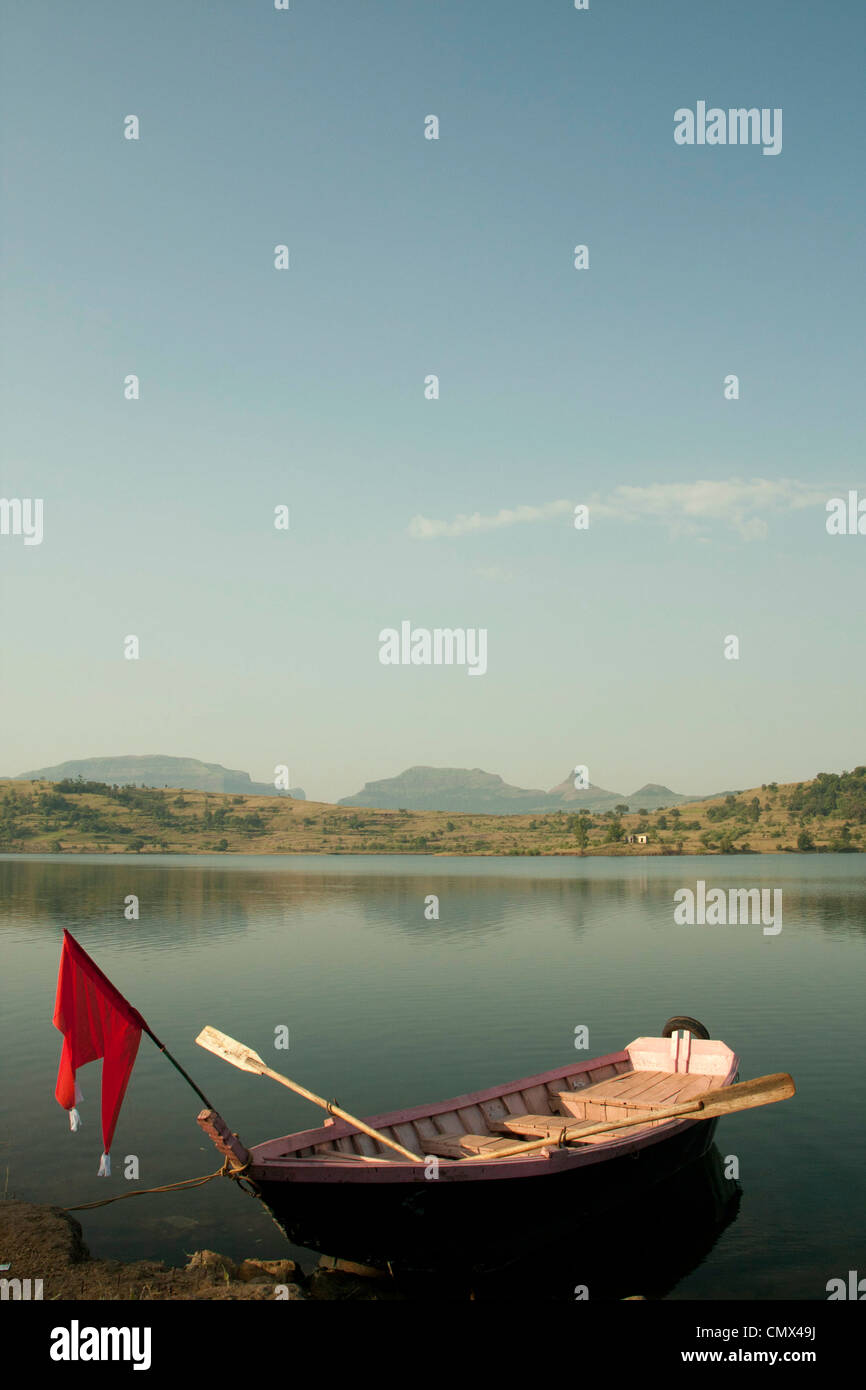 Rowing boat moored on indian lake Stock Photo Alamy