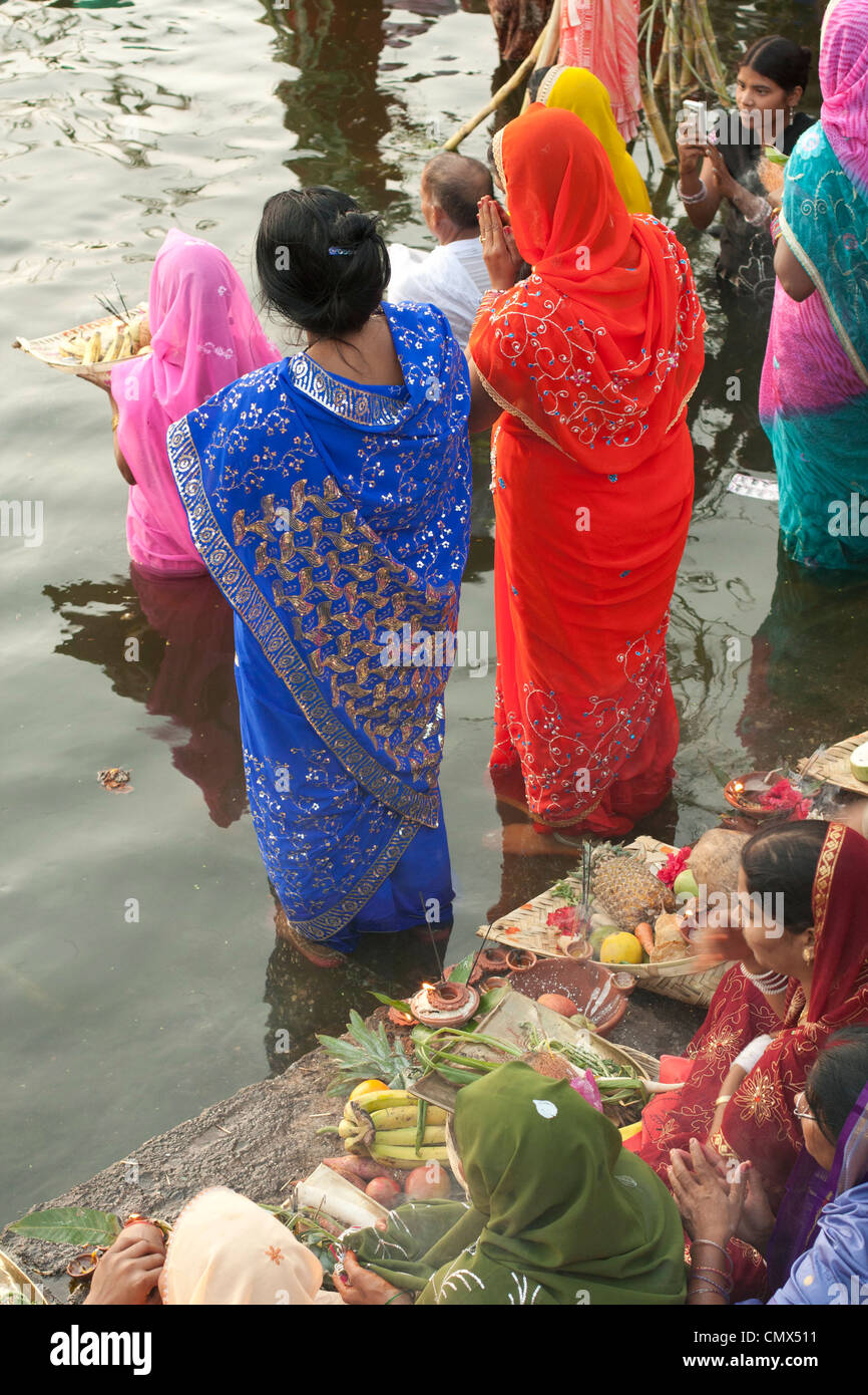 prayer offerings into Indian river Stock Photo Alamy