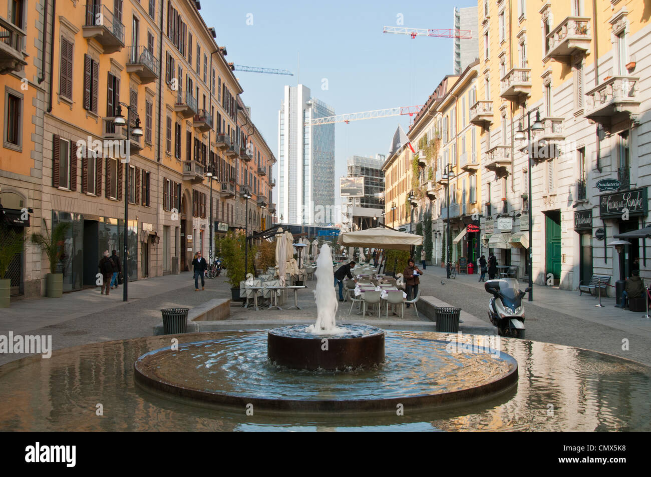 Pedestrianised street with water feature in Milan Stock Photo