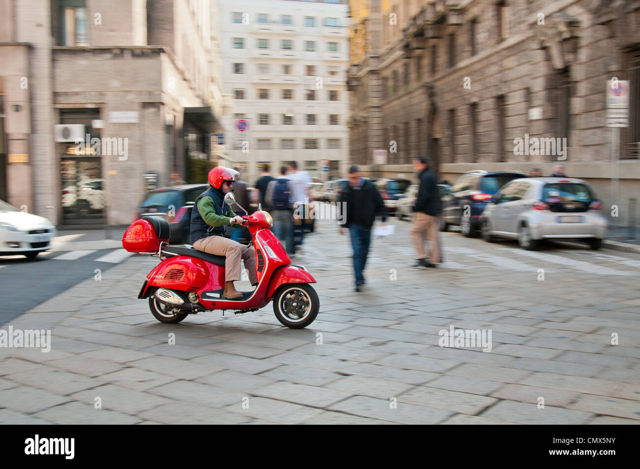 Moped /scooter rider in Milan Stock Photo Alamy