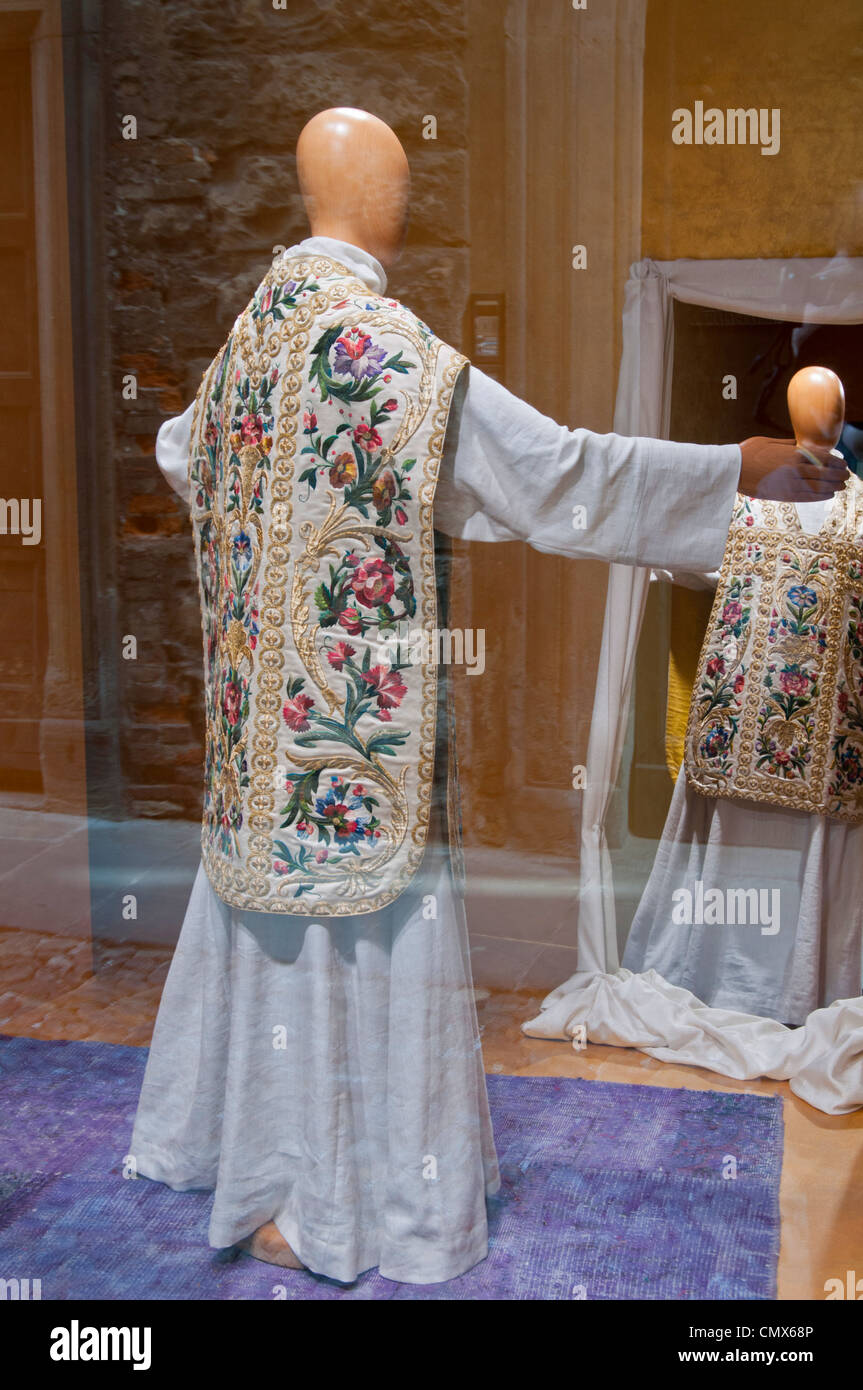 Italian Ecclesiastical gowns / robes in a makers shop window Stock Photo