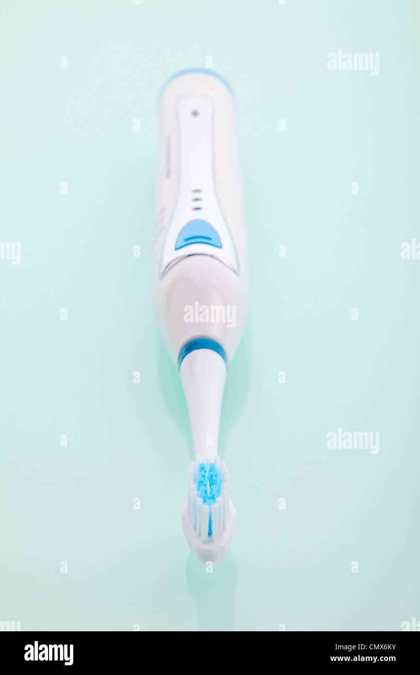 Electric toothbrush on white background, close up Stock Photo - Alamy
