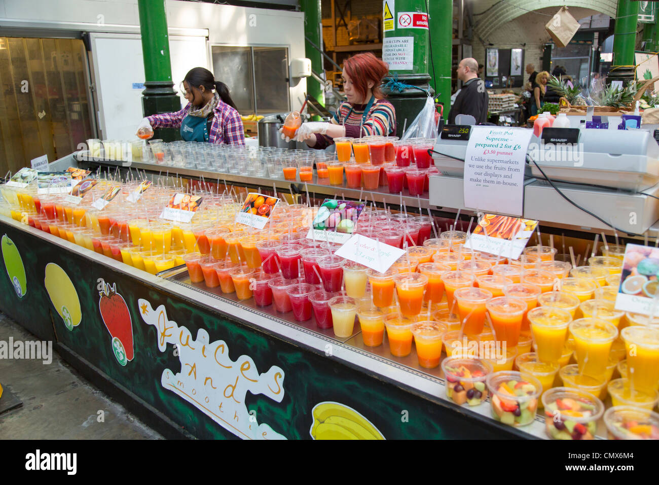 Fruit juices and smoothies for sale at Borough Market, London UK Stock