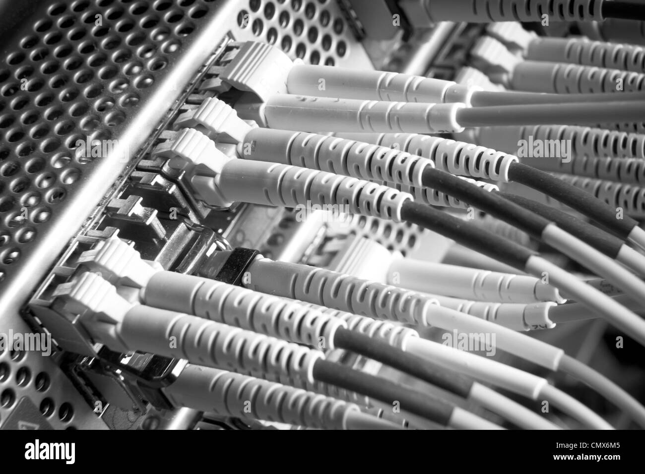 optic fiber cables connected to hub Stock Photo