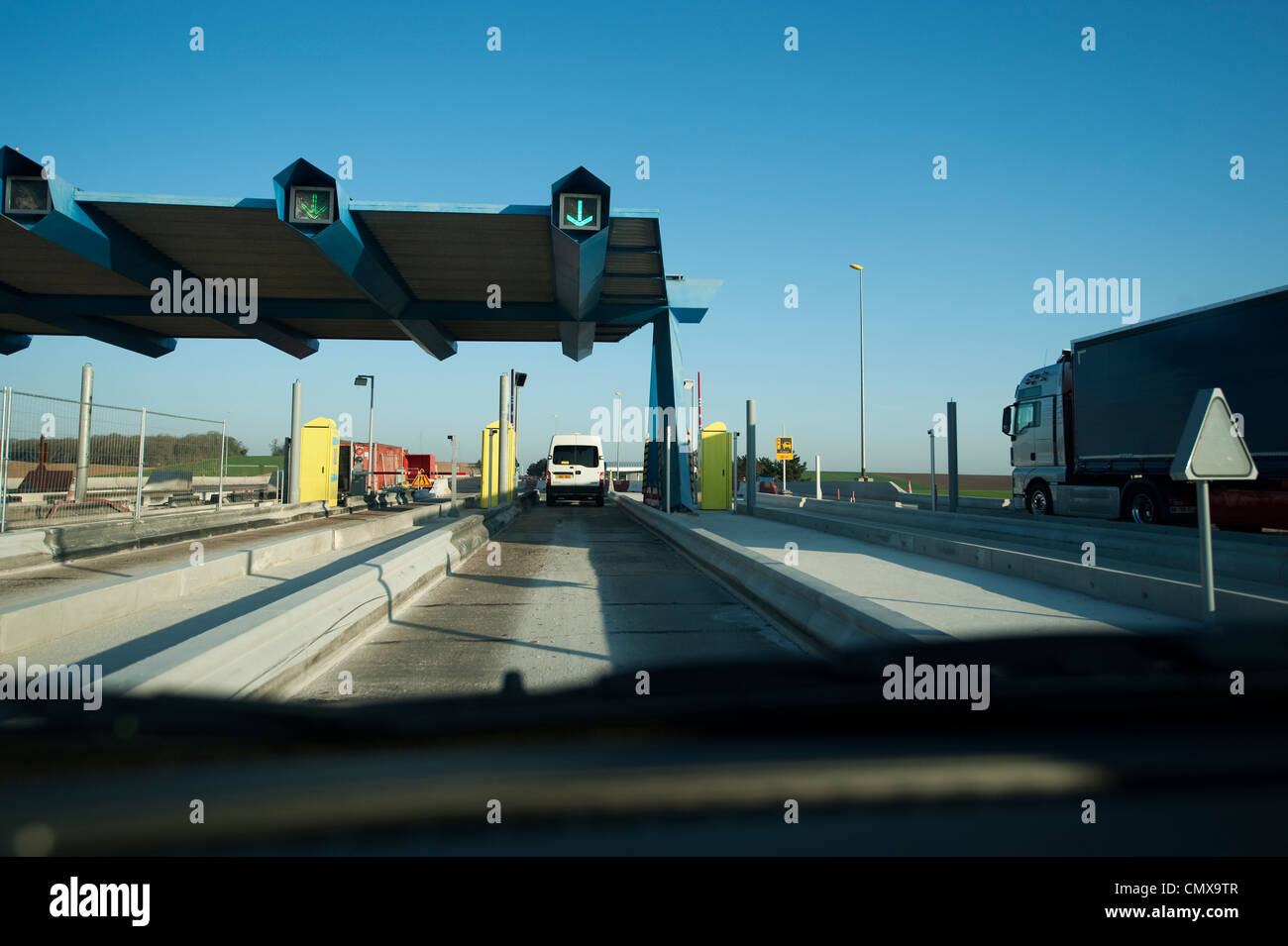 Approaching a toll gate on the Autoroute des Anglais A26 heading north in northern France Stock Photo