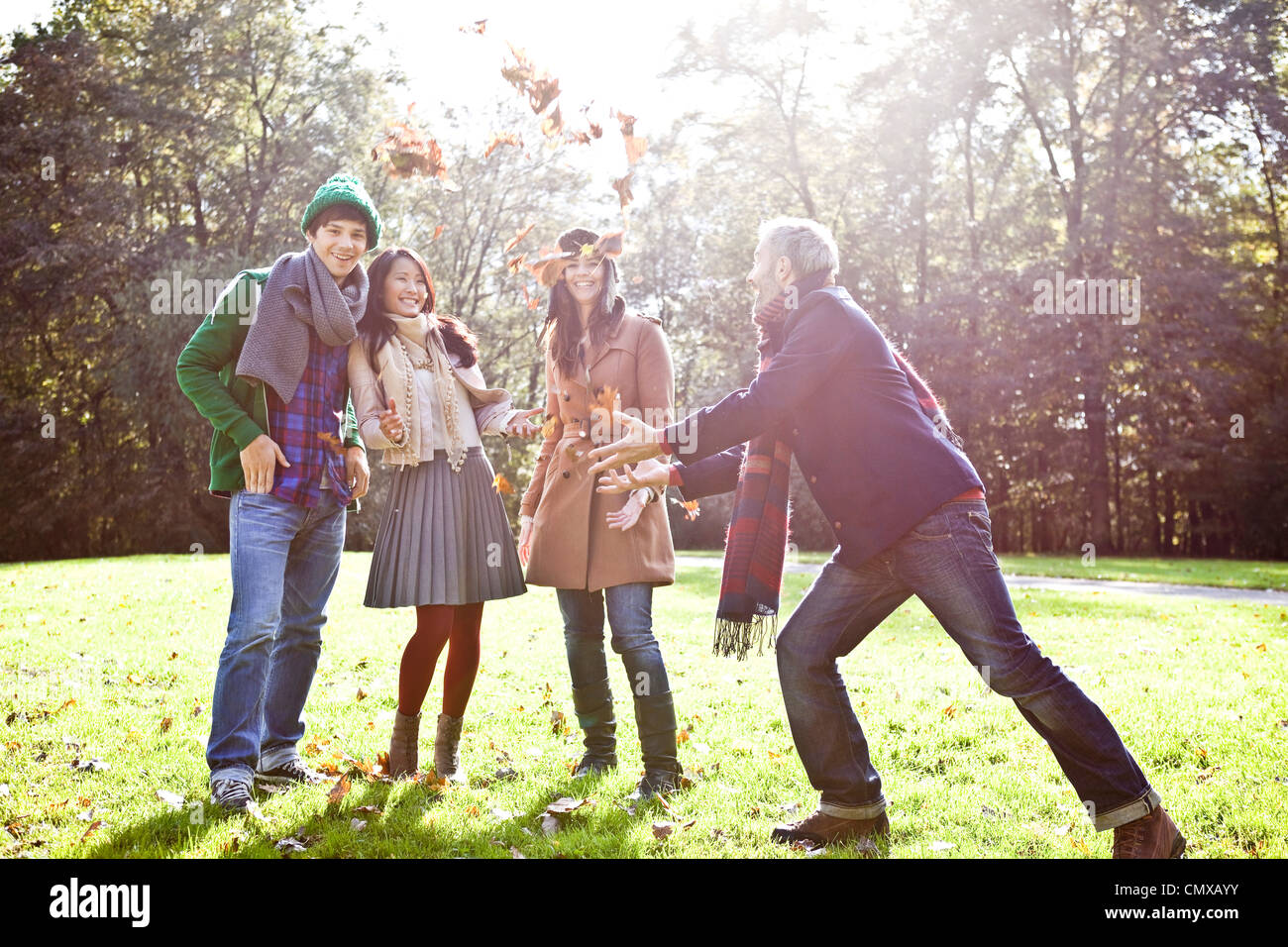 Germany, Cologne, Man and woman enjoying in park, smiling Stock Photo