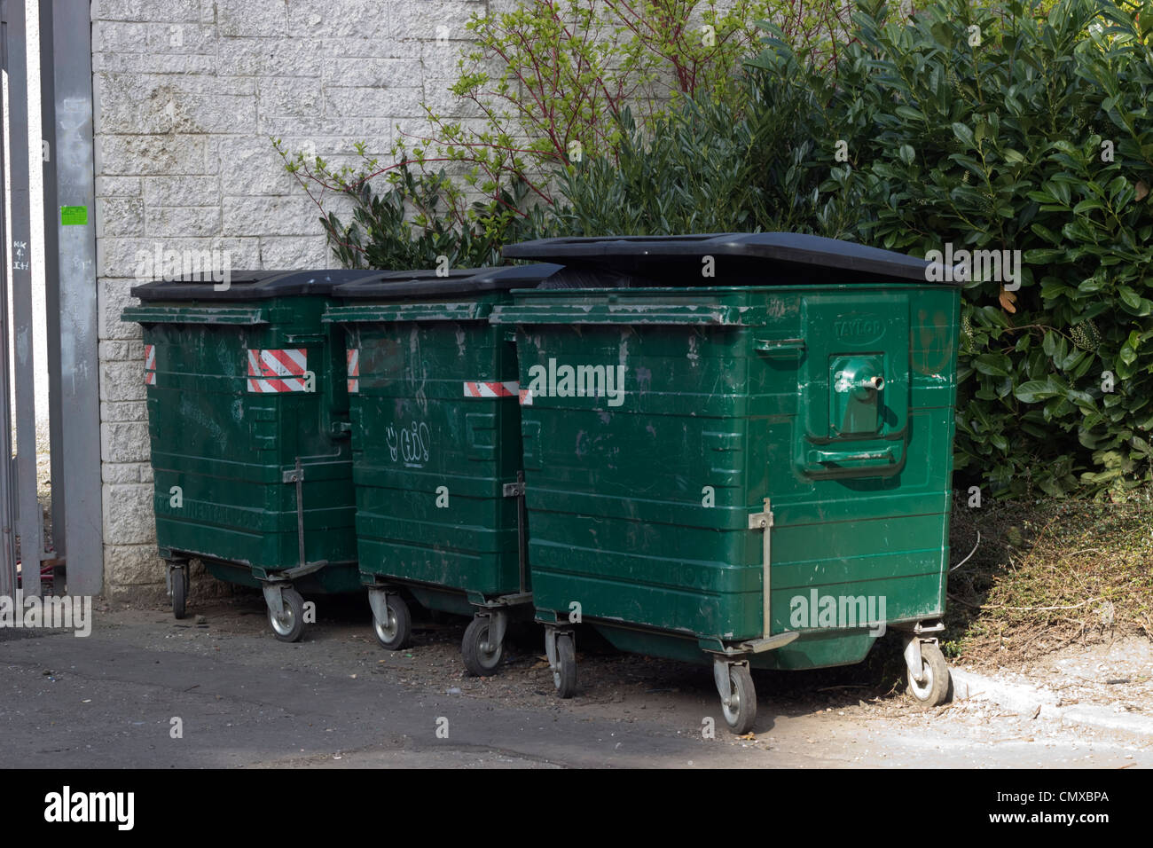 Green council rubbish bins Stock Photo Alamy