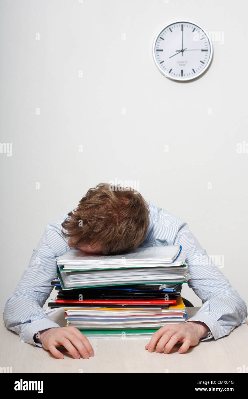A tired business man sleeping Stock Photo