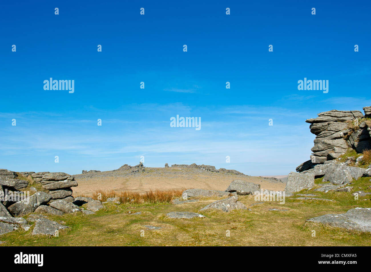 Granite Tors in the Dartmoor National Park Devon England with with outcrops of granite winter moorland scene and blue skys. Stock Photo
