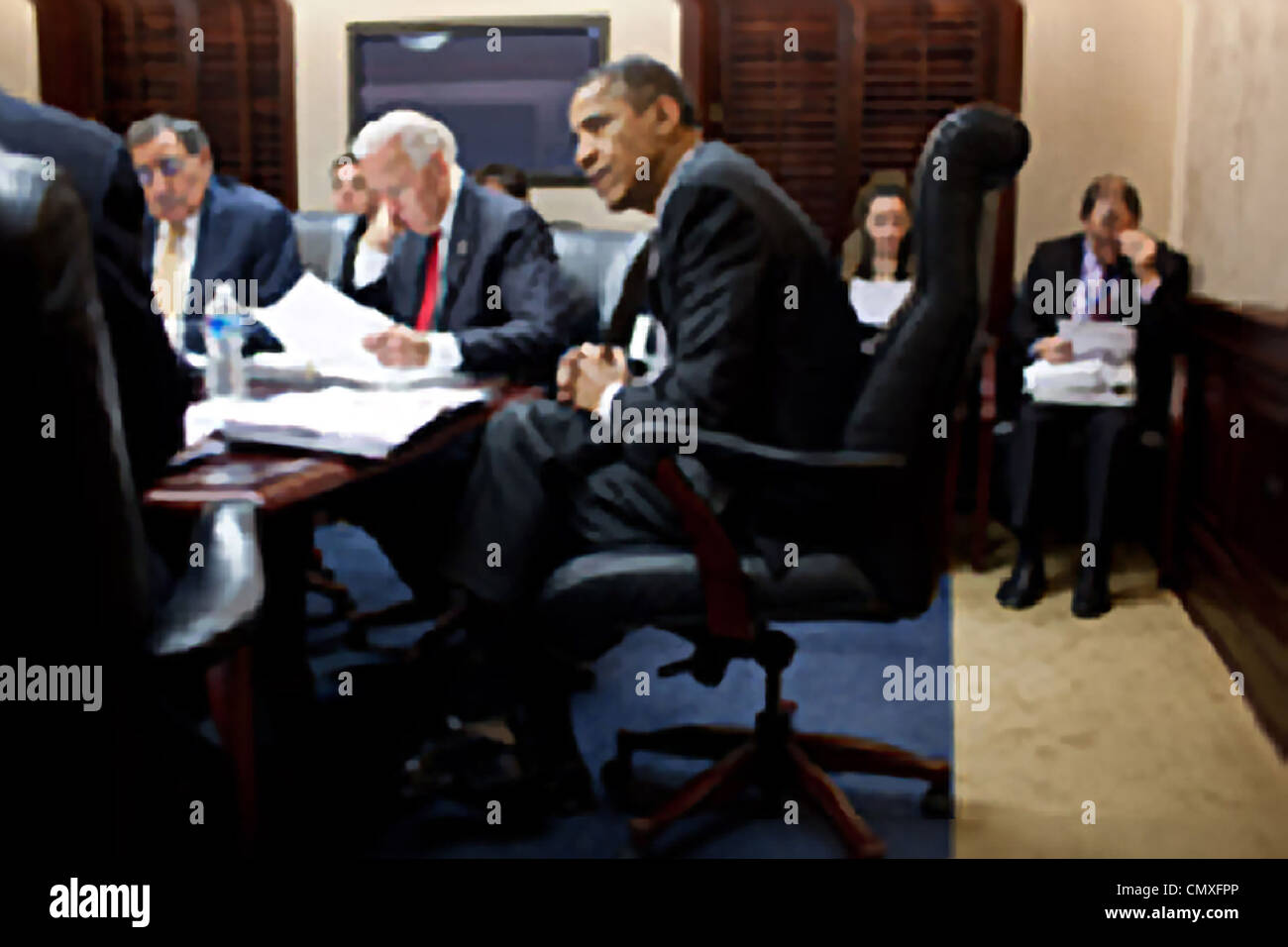 President Barack Obama and Vice President Joe Biden meet with members of the national security team regarding Afghanistan and Pakistan in the Situation Room of the White House February 8, 2012 in Washington, DC. Stock Photo