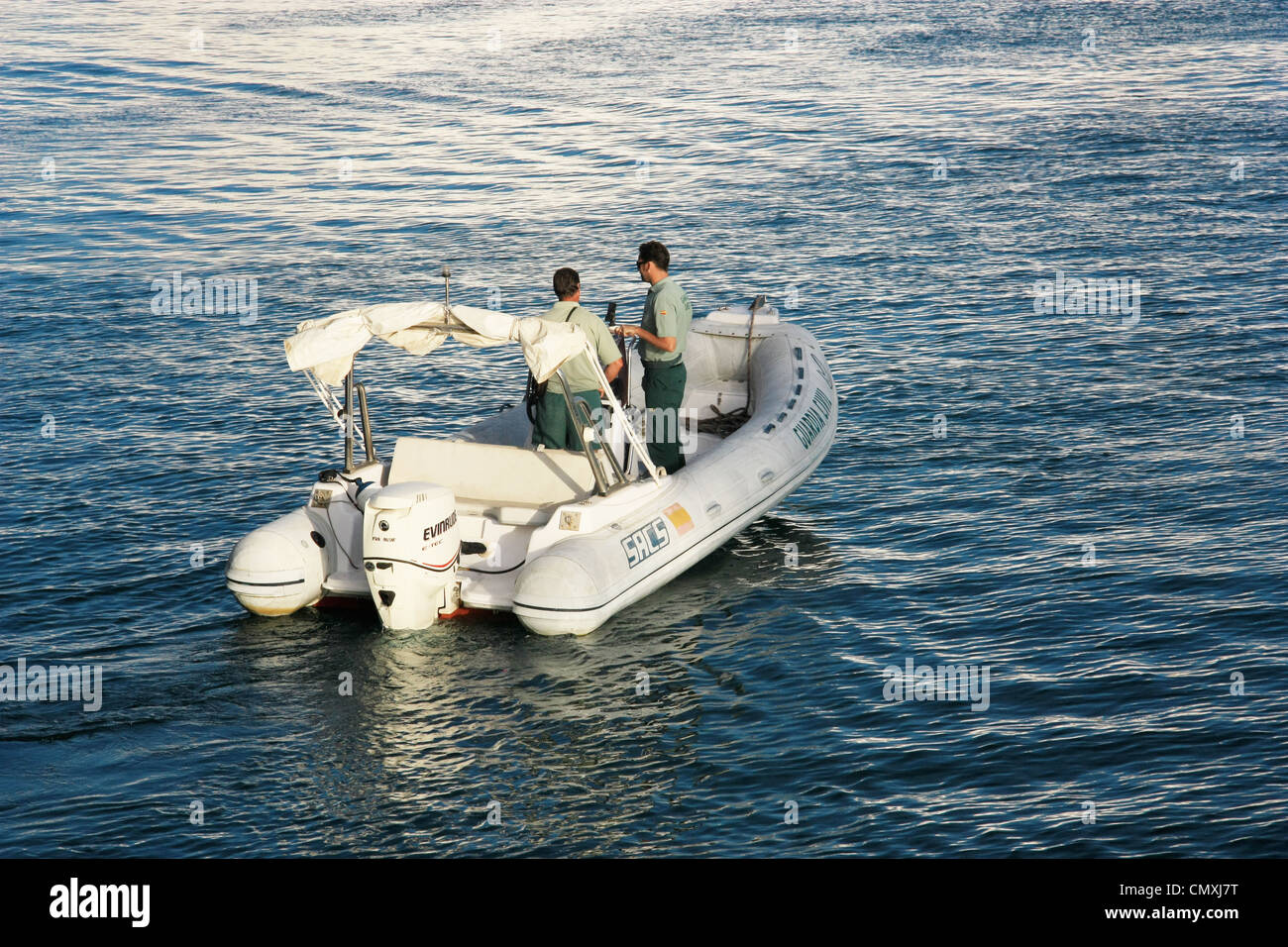 The Guardia Civil coast guard patrolling the harbor of Las Palmas in a zodiac boat Stock Photo