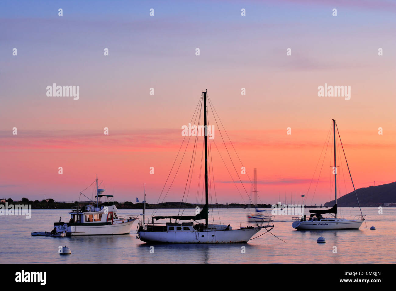 Sailboats anchored in San Diego Bay at sunset as seen from Shelter