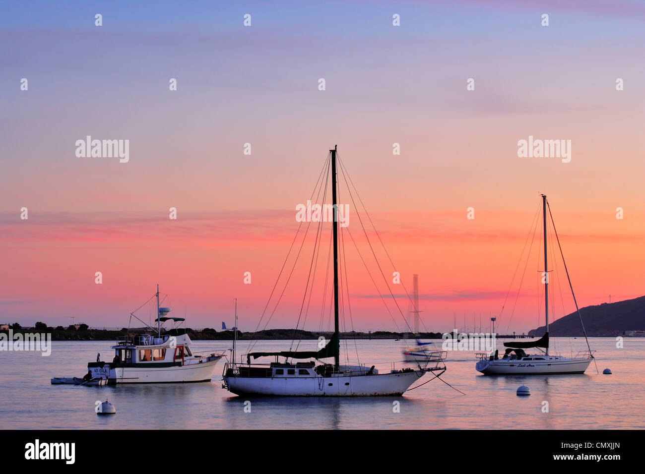 Sailboats anchored in San Diego Bay at sunset as seen from Shelter island-San Diego, California, USA. Stock Photo