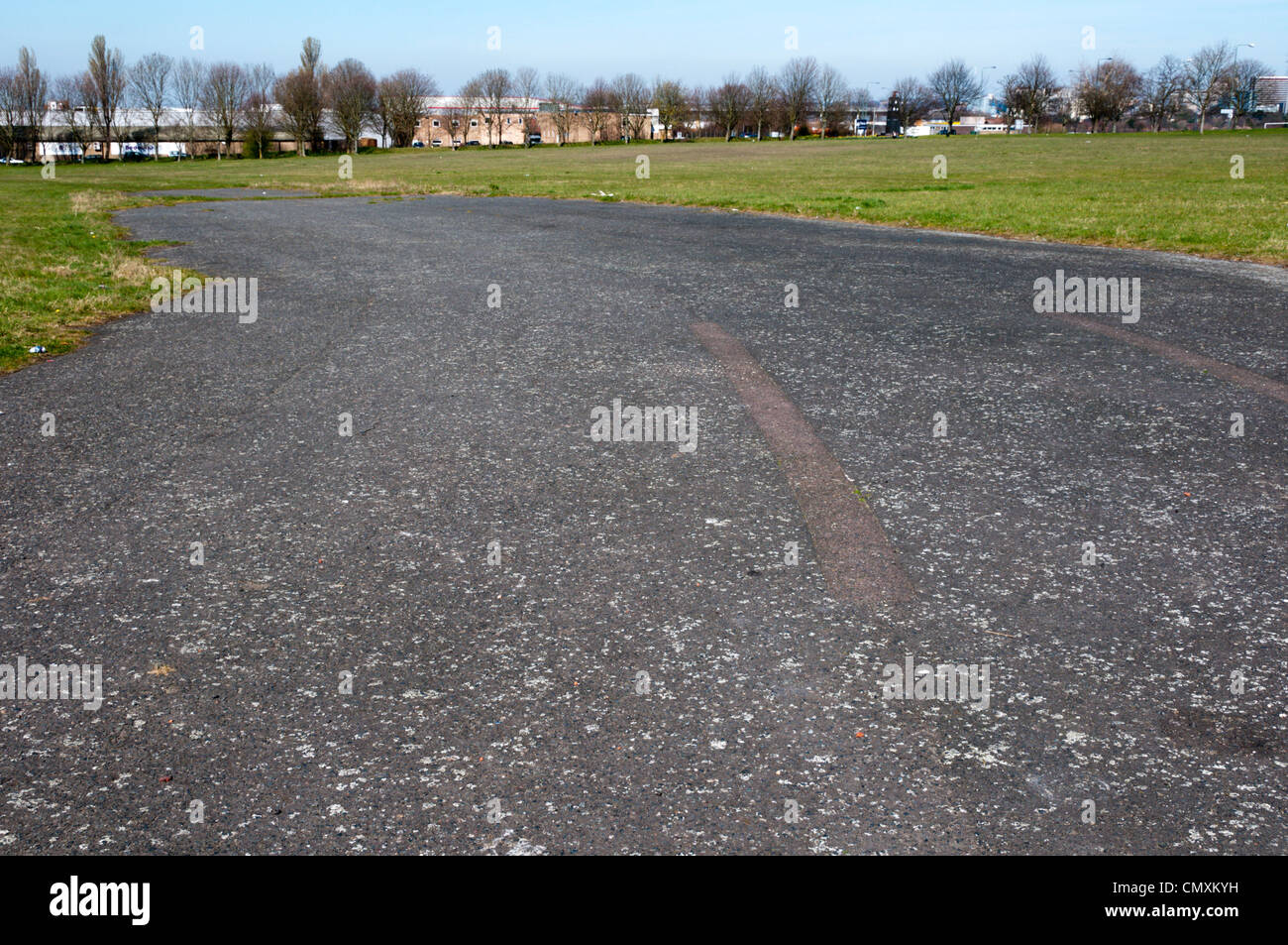 This area of tarmac is all that is left of the runways of the old Croydon Aerodrome in Roundshaw Park. SEE DESC FOR DETAILS. Stock Photo