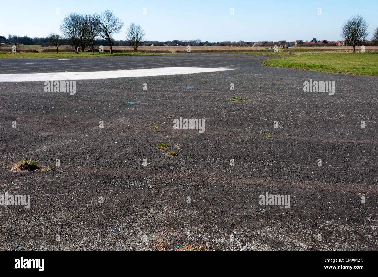 This area of tarmac is all that is left of the runways of the old Croydon Aerodrome in Roundshaw Park. SEE DESC FOR DETAILS. Stock Photo