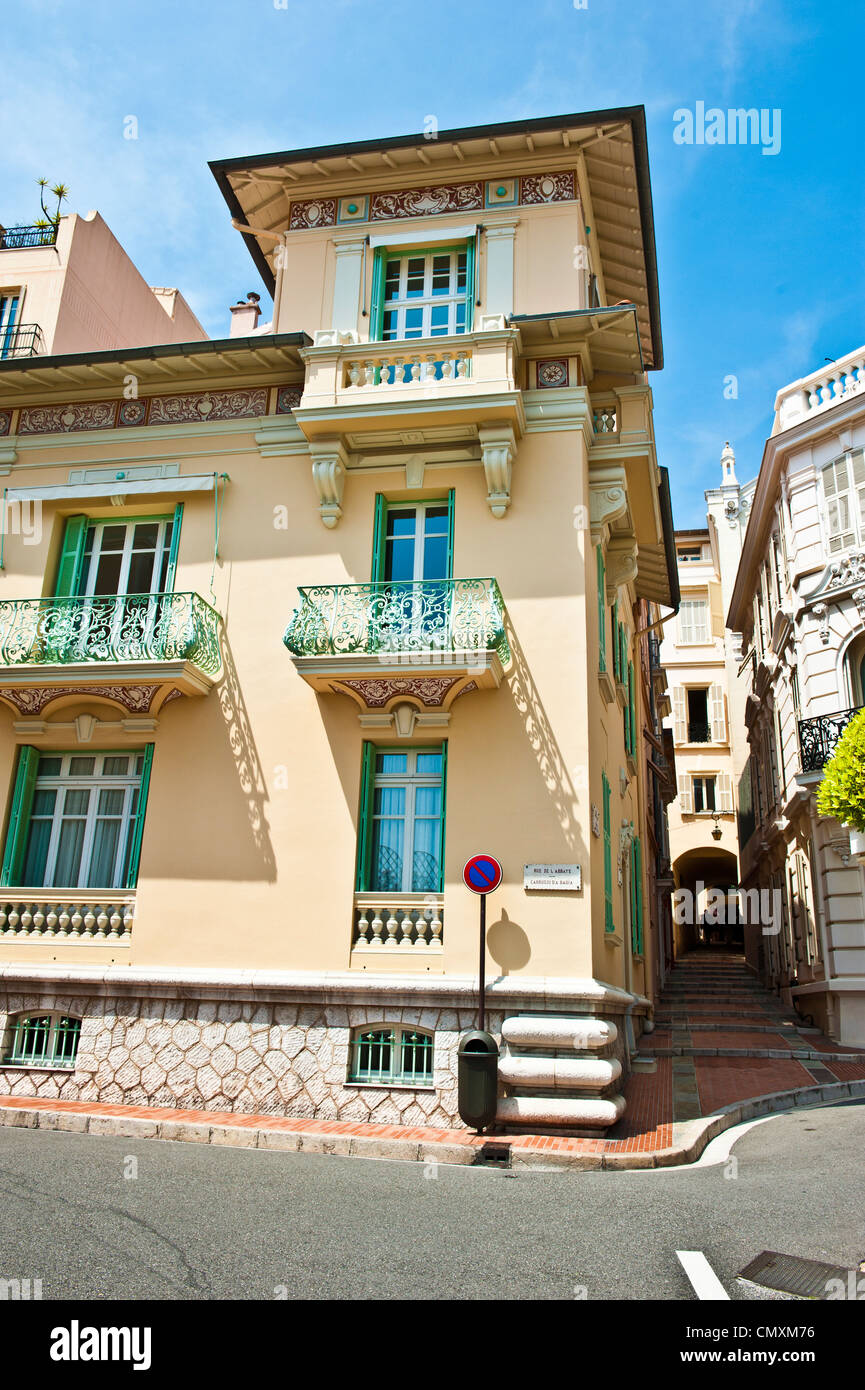 Beautifu, ornamental, mint green balconies and window panels on a beige building Monaco. Stock Photo
