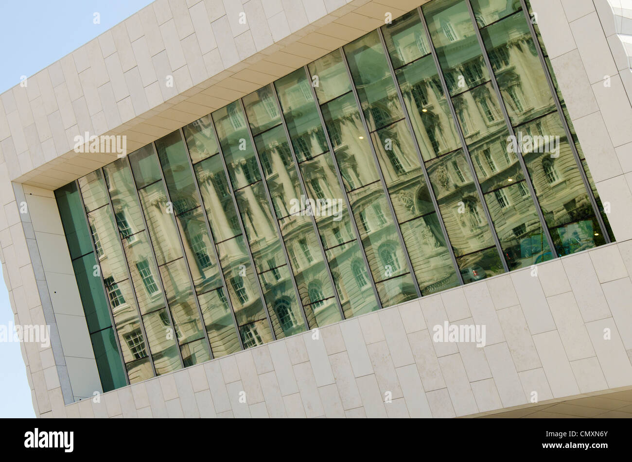 Facade of the new Museum of Liverpool (opened 2011) alongside the Pier Head with reflection of the Port of Liverpool Building Stock Photo