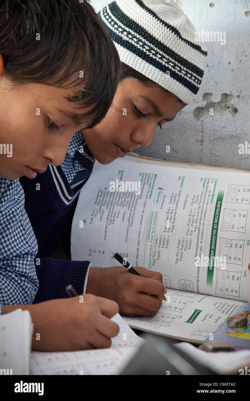 Madrasa Students Doing their Mathematics Lesson, Madrasa Islamia Arabia Izharul-Uloom, Dehradun, India. Stock Photo