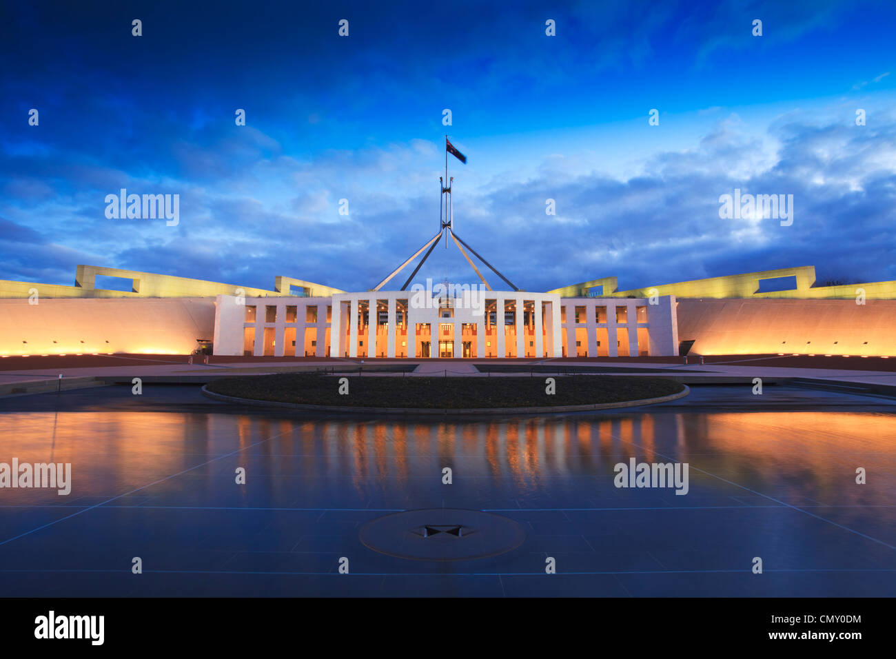 Dramatic evening sky over Parliament House, Canberra, Australia, illuminated at twilight. Stock Photo