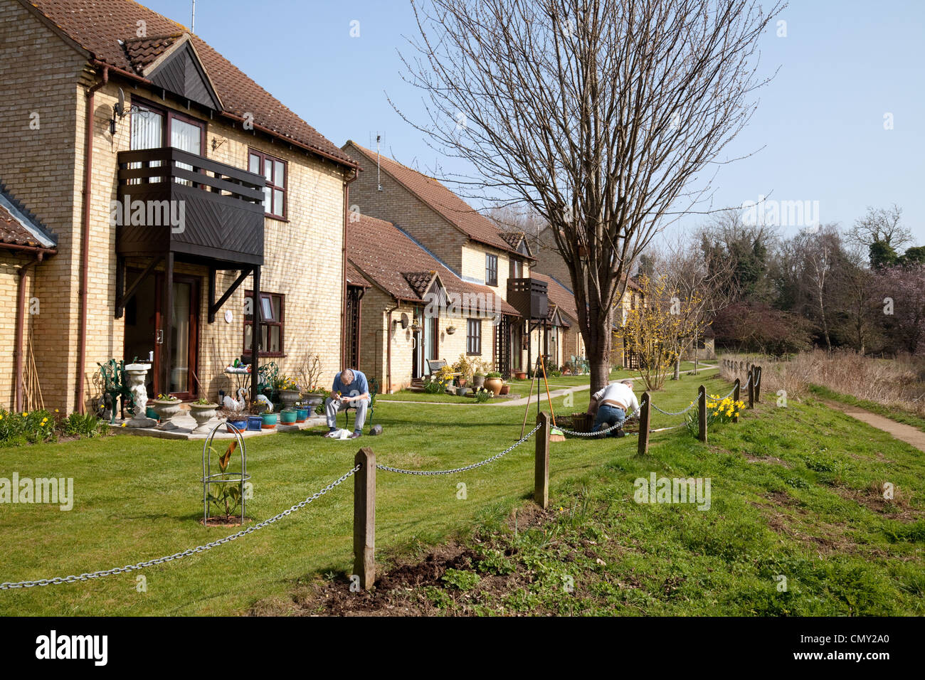 Elderly men in the gardens of their retirement homes, Mildenhall