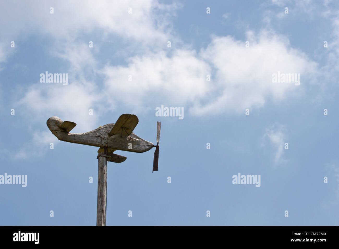 a wooden toy airplane that indicates the direction of the wind Stock Photo