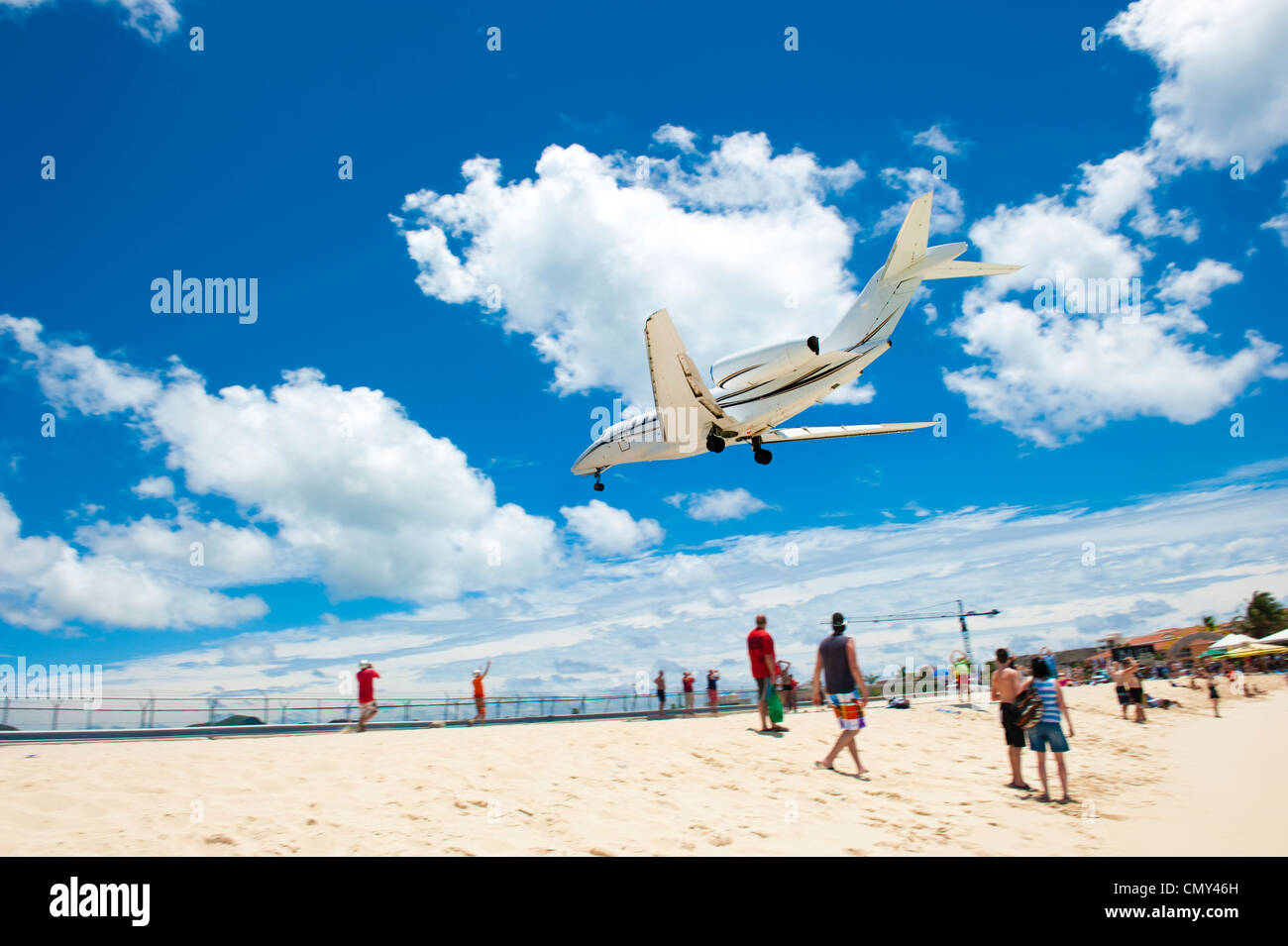 A large airplane landing on a remote island for a vacation. Stock Photo